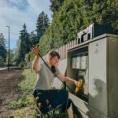 woman fixing electrical system